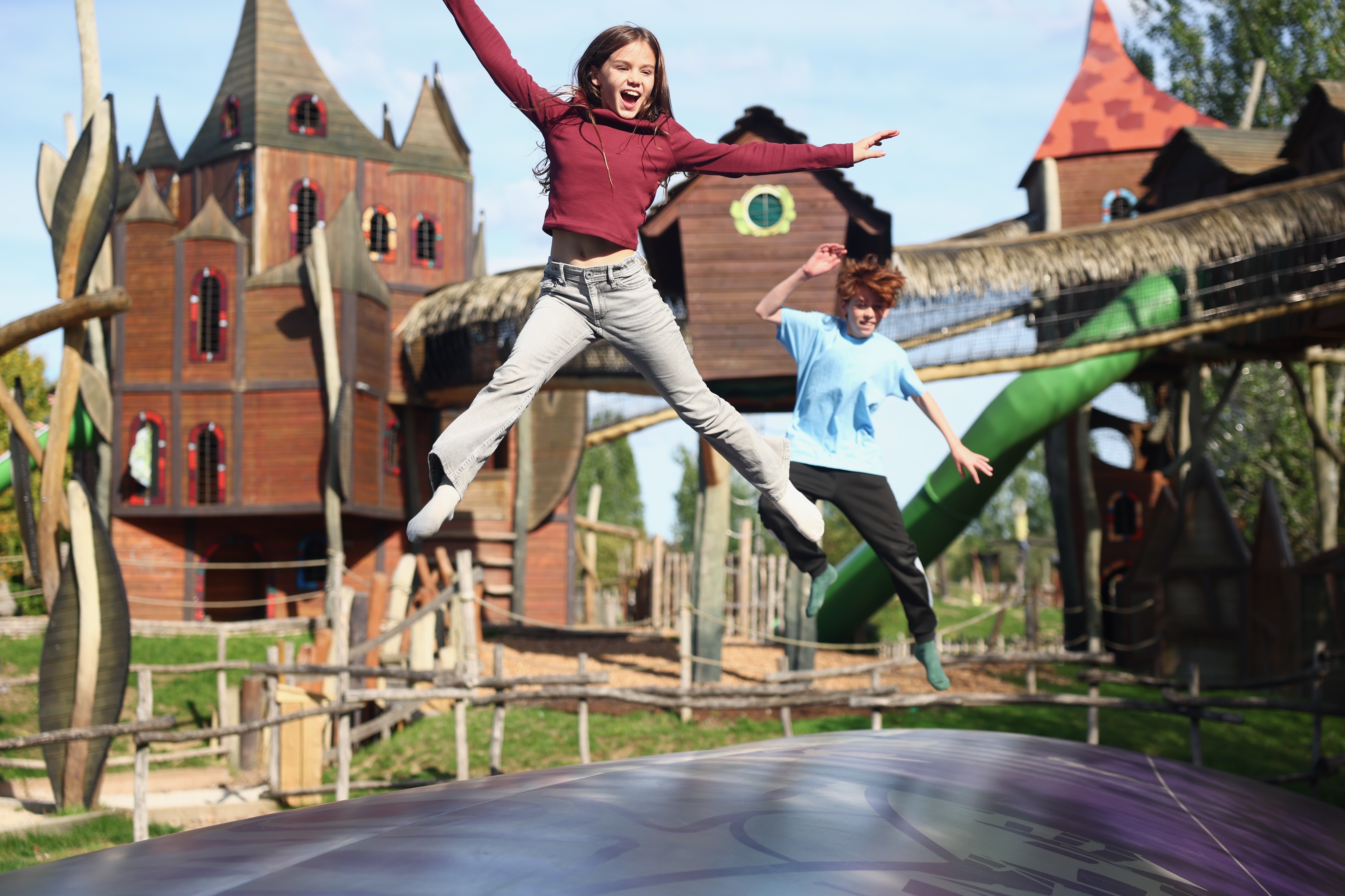 Kids jumping on a giant bouncing pillow at Hobbledown Epsom adventure park playground in Surrey