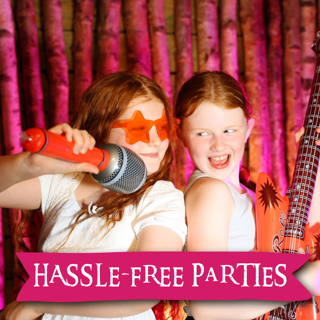 Kids performing with microphone and guitar at a Hobbledown hassle-free birthday party